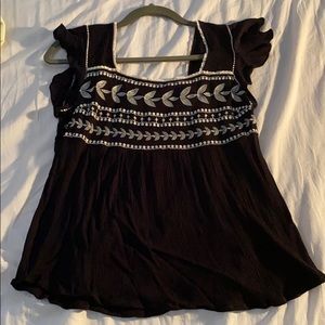 Black top wirh embroidered details